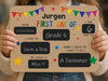 Child holding personalised first day of school board for milestone photo