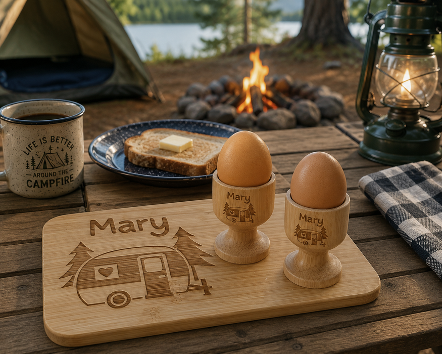 Personalised camping breakfast set featuring a custom engraved bamboo chopping board and matching egg cup, perfect for caravans, camping trips and outdoor adventures.