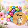 Jar of colorful Easter eggs with a personalized wooden plaque featuring a rabbit and floral design, on a pastel background.