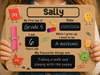 A personalized sign held by a child's hands, featuring cute cartoon drawings of school supplies and text fields for a child's first day of school, age, and future goals.