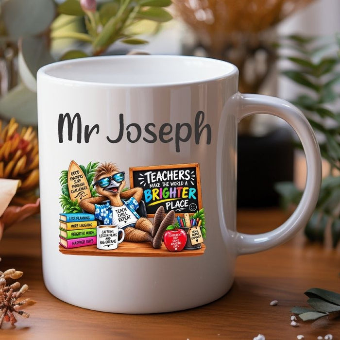 A white ceramic mug with a custom cartoon illustration of a sloth wearing sunglasses and a blue shirt, sitting on a wooden table with a blurred background of plants and dried flowers. The mug has the text 'Mr Joseph' printed in black above the illustration.